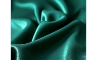 Nærstudie av glatt, skinnende italiensk silke i en dyp juvelfarge.